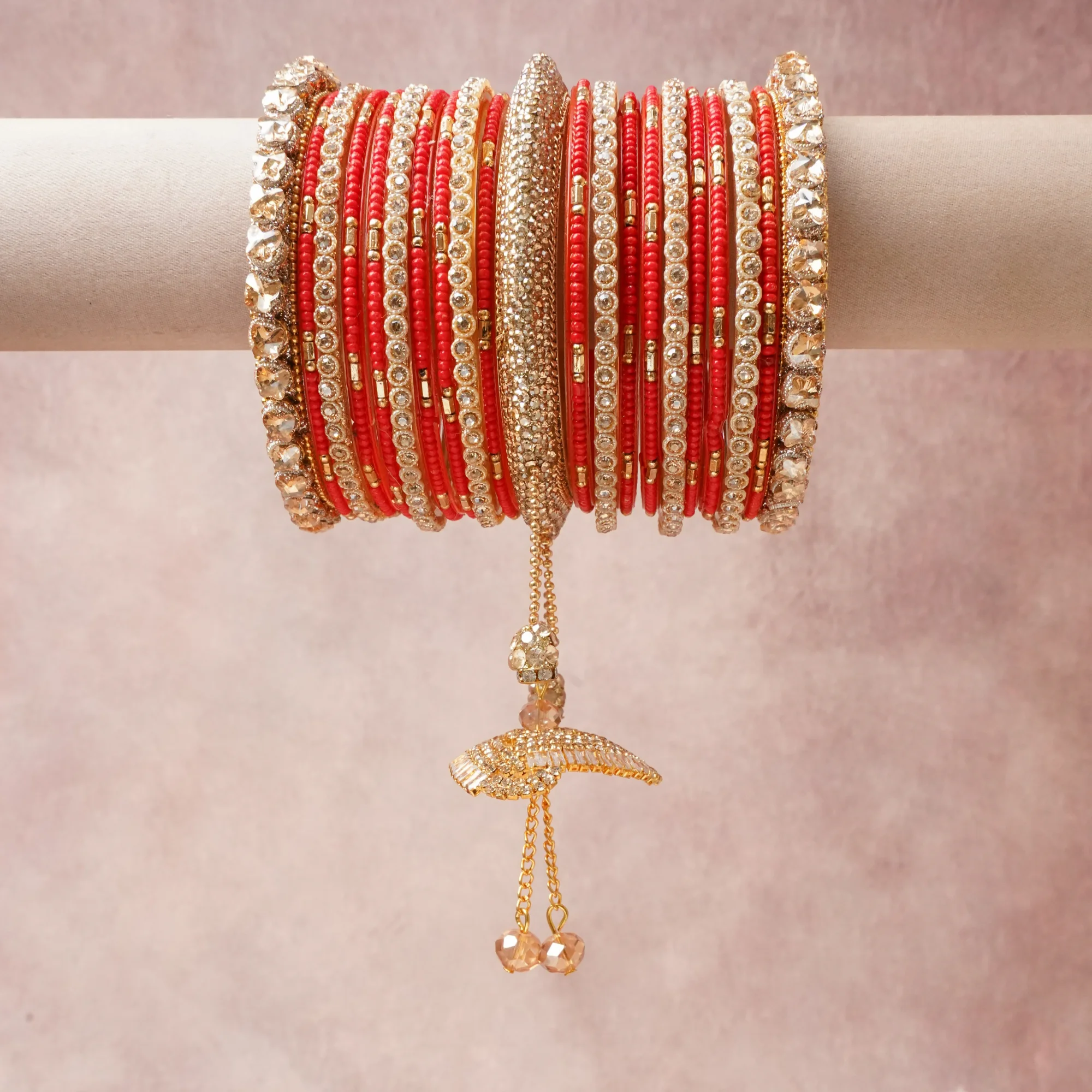 A commanding Chilli Red anchors this beautiful set, enriched with accents of Gold that add depth and dimension.

Featuring a striking composition of Gold-toned Metal, Glass Beads, Faceted Crystals, this set carries intricate craftsmanship and strong presence. Grand in form, it is created for moments that deserve to be marked.